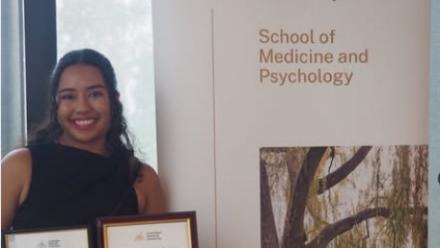 Olivia Taifalos with award